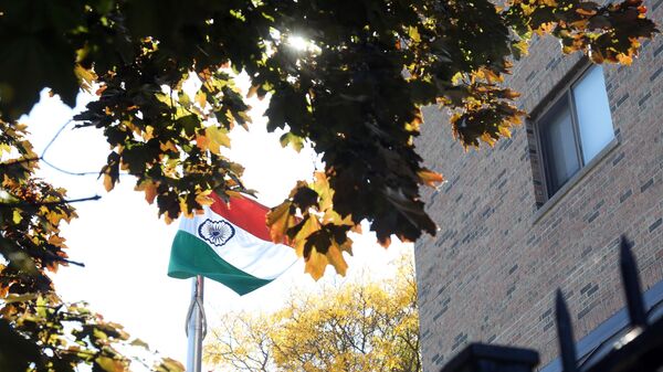 A India flag waves in the wind at the High Commission of India October 3, 2023 in Ottawa, Canada. Canada sought Tuesday to maintain its full diplomatic presence in India, after New Delhi reportedly ordered Ottawa to withdraw 40 diplomats in a dispute over the killing of a Sikh separatist. - Sputnik भारत