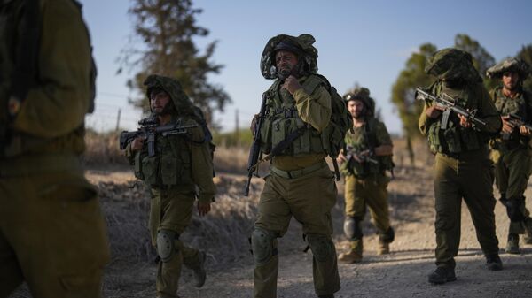 Israel soldiers patrol near the border between Israel and Gaza Strip, Israel, Thursday, Oct. 19, 2023.  - Sputnik भारत