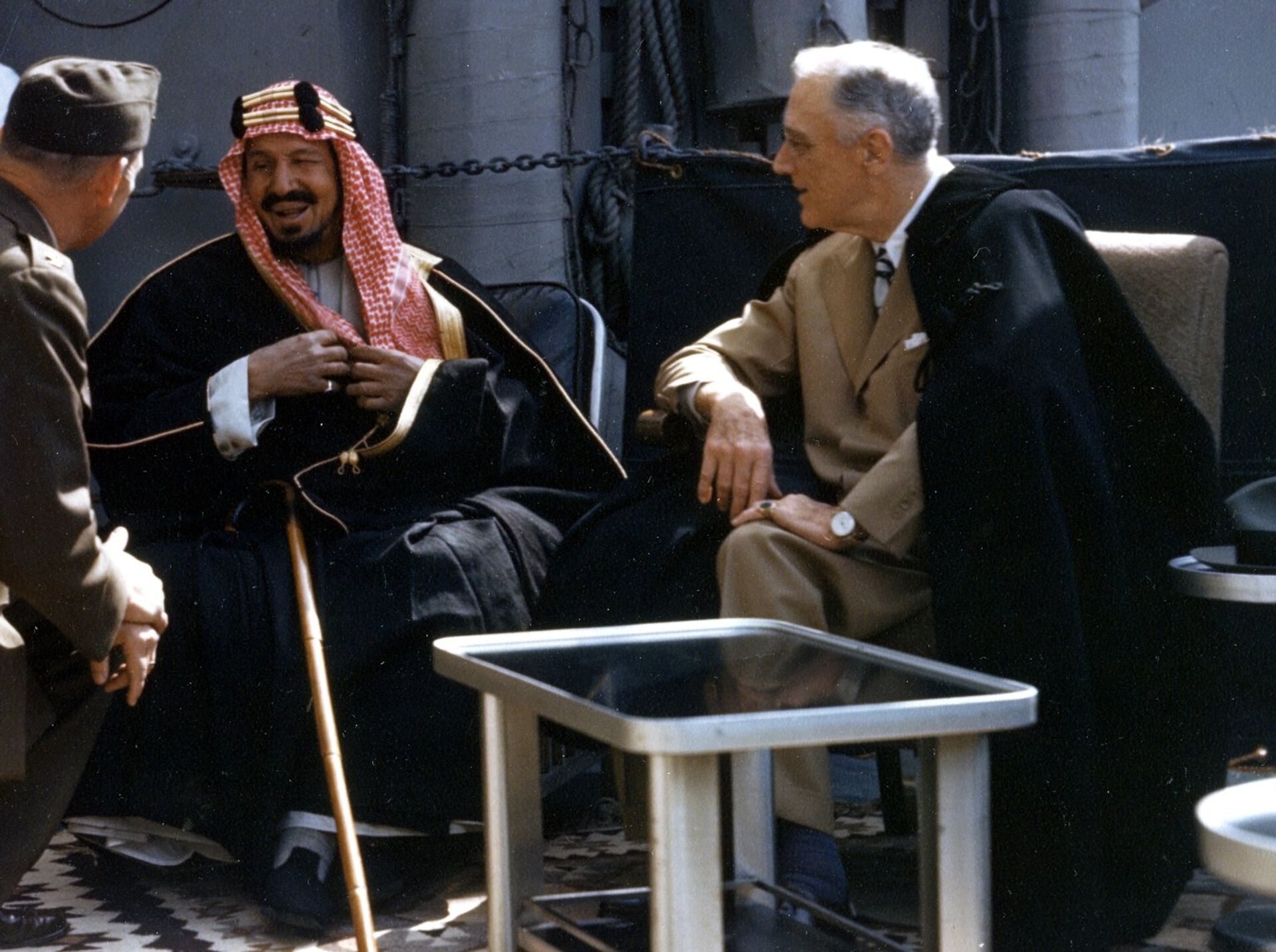 The U.S. President Franklin D. Roosevelt meets with King Ibn Saud of Saudi Arabia, on board the U.S. Navy heavy cruiser USS Quincy (CA-71) in the Great Bitter Lake, Egypt, on 14 February 1945. The King is speaking to the interpreter, Colonel William A. Eddy, USMC. - Sputnik India, 1920, 24.10.2023