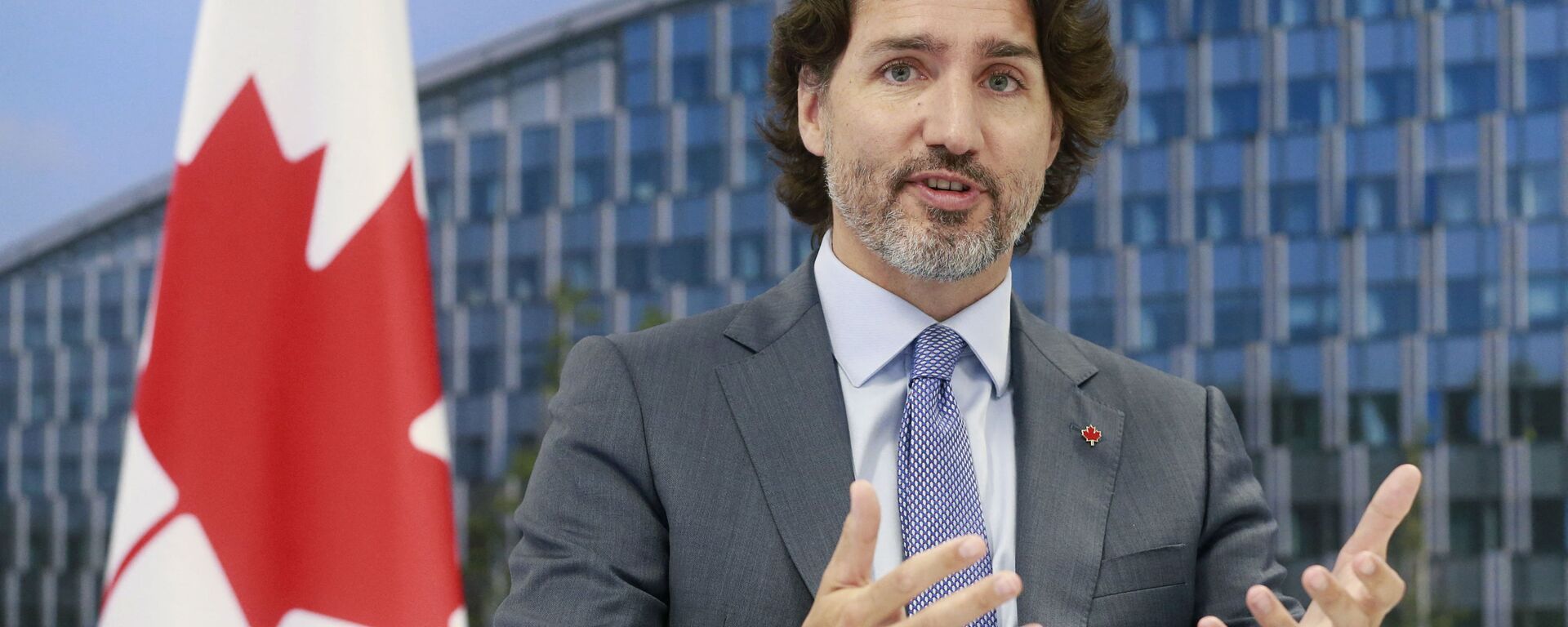 Canada's Prime Minister Justin Trudeau  speaks to the NATO Secretary General during a NATO summit at the North Atlantic Treaty Organization (NATO) headquarters in Brussels on June 14, 2021.  - Sputnik India, 1920, 25.10.2023