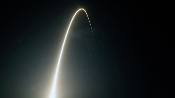 In this time-exposure photograph, a SpaceX Falcon 9 rocket with the 25th batch of approximately 60 satellites for SpaceX's Starlink broadband network lifts off from the Space Launch Complex 40 at the Cape Canaveral Space Force Station in Cape Canaveral, Fla., late Wednesday, April 28, 2021. - Sputnik India