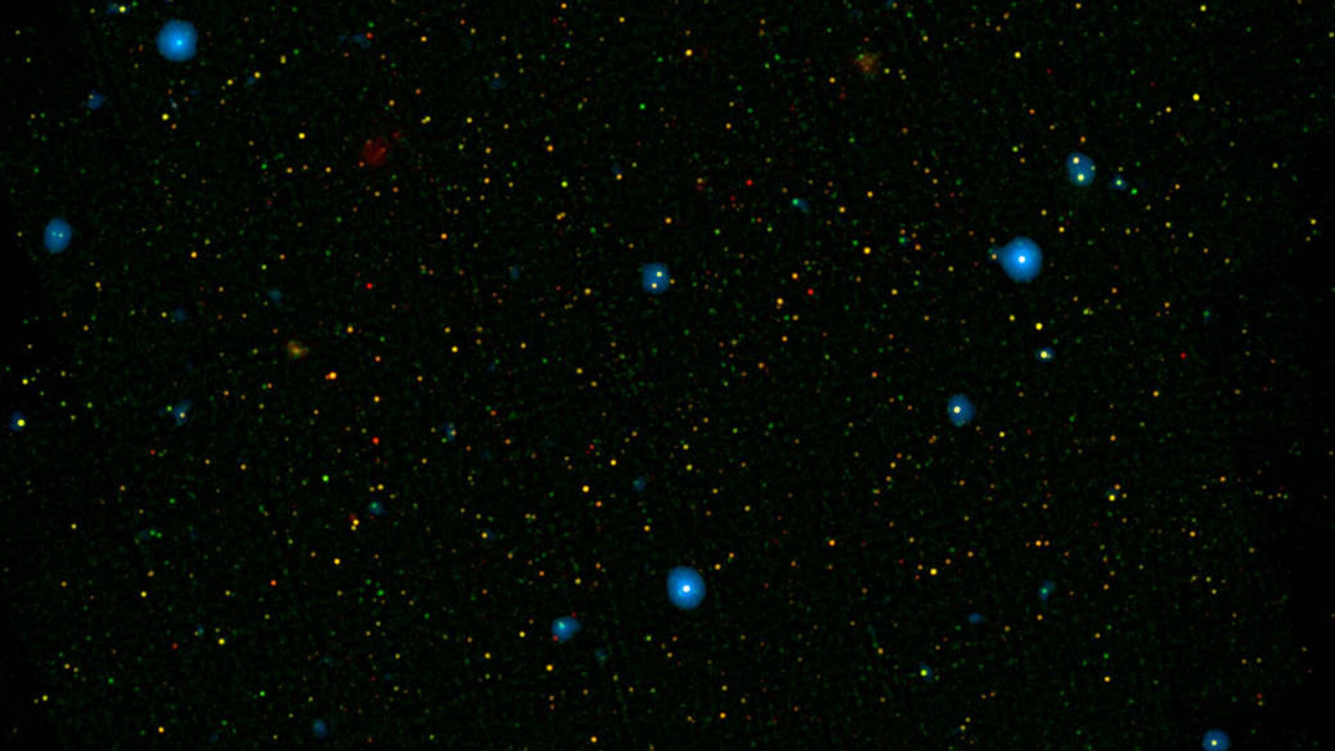 The blue dots in this field of galaxies, known as the COSMOS field, show galaxies that contain supermassive black holes emitting high-energy X-rays - Sputnik भारत, 1920, 30.10.2023