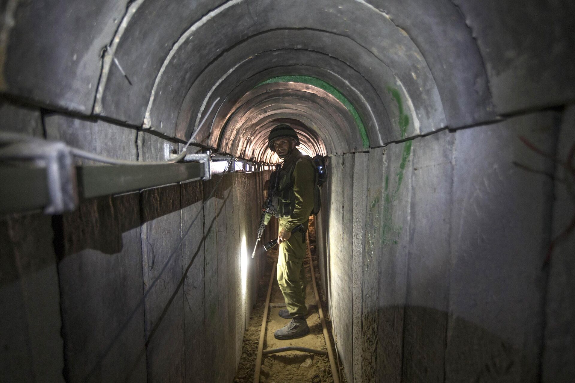 FILE - In this Friday, July 25, 2014 file photo, an Israeli army officer gives journalists a tour of a tunnel allegedly used by Palestinian militants for cross-border attacks, at the Israel-Gaza Border. - Sputnik India, 1920, 06.11.2023