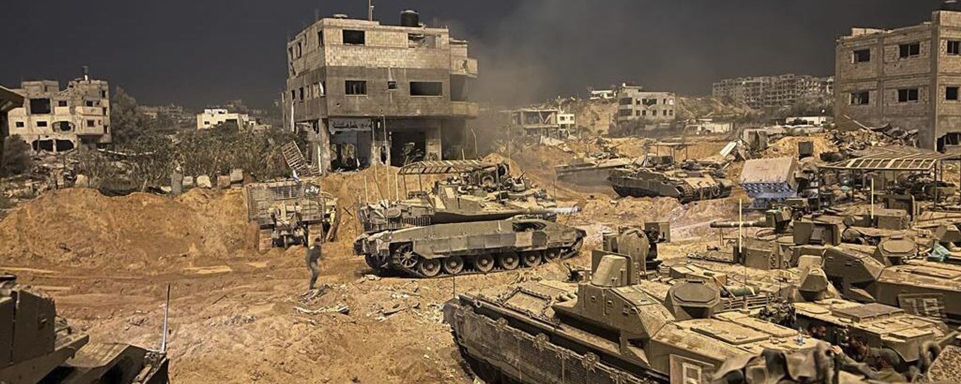 In this undated photo provided by the Israeli military, Israeli armored personnel carriers are seen during a ground operation in the Gaza Strip. Israeli ground forces have been operating in Gaza in recent days as Israel presses ahead with its war against Hamas militants - Sputnik India, 1920, 07.11.2023