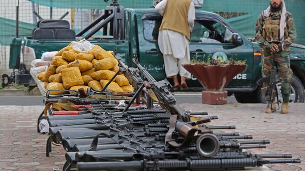 Taliban security personnel display seized weapons and drugs to the media after an operation in Jalalabad on March 2, 2023. - Sputnik India