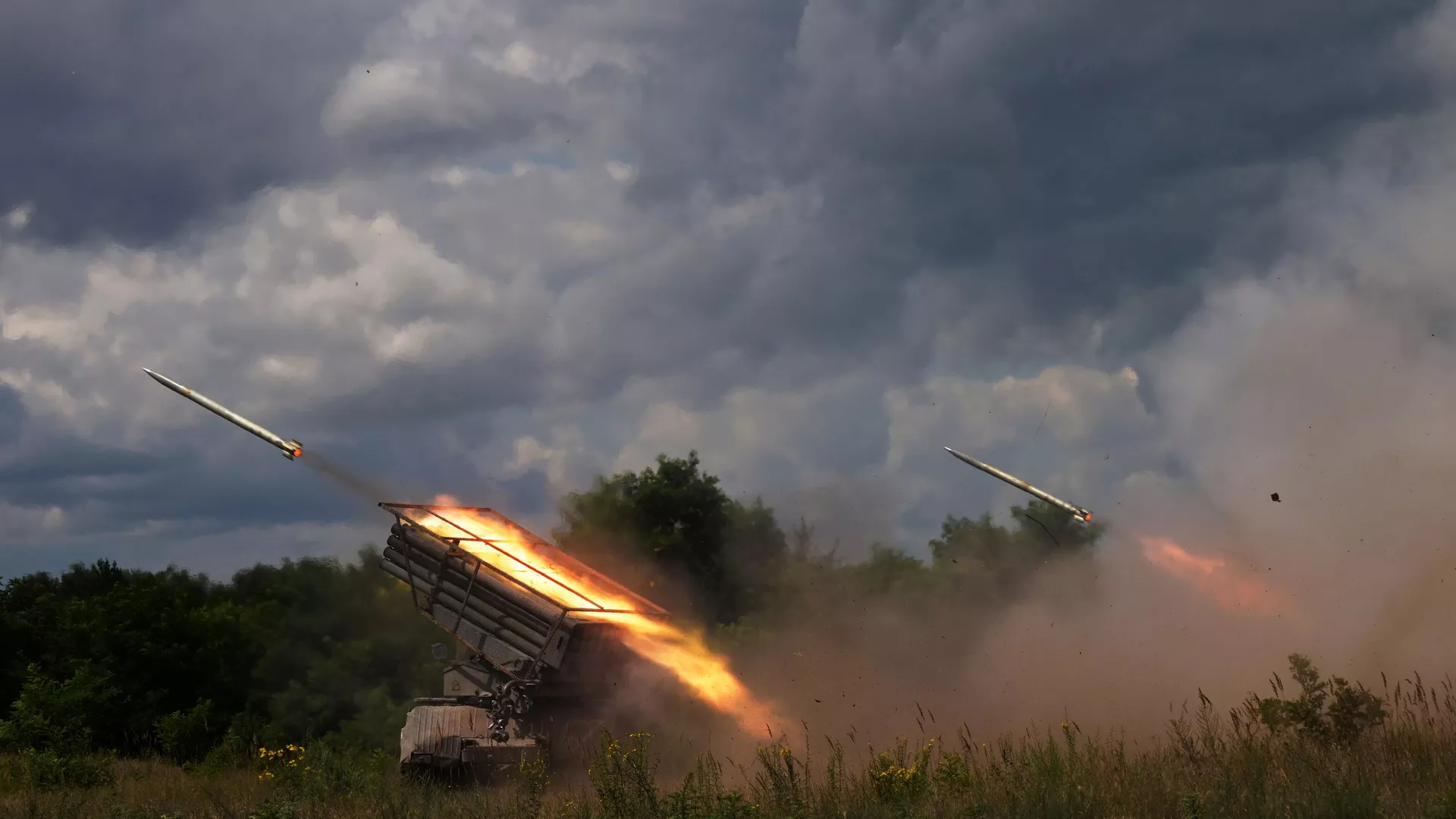 Russian servicemen of the Central Military District fire BM-21 Grad multiple rocket launchers towards Ukrainian positions, in the course of Russia's military operation in Ukraine, in Lugansk People's Republic, Russia