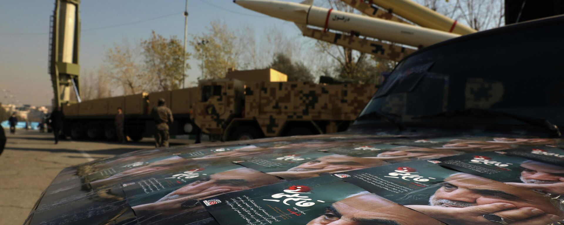 Posters of Iranian Gen. Qassem Soleimani, who was killed in Iraq in a U.S. drone attack in Jan. 3, 2020, are seen in front of Qiam, background left, Zolfaghar, top right, and Dezful missiles displayed in a missile capabilities exhibition by the paramilitary Revolutionary Guard a day prior to second anniversary of Iran's missile strike on U.S. bases in Iraq in retaliation for killing Gen. Soleimani, at Imam Khomeini grand mosque, in Tehran, Iran, Friday, Jan. 7, 2022. Iran put three ballistic missiles on display on Friday, as talks in Vienna aimed at reviving Tehran's nuclear deal with world powers flounder.  - Sputnik India, 1920, 16.05.2024