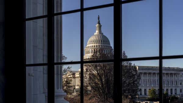 The U.S. Capitol is seen through a window in the Russell Senate Office Building in Washington, March 15, 2023.  - Sputnik भारत
