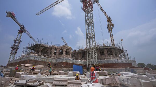 Workers are engaged in the construction of a temple of Hindu god Ram, at the site of demolished Babri Masjid mosque in Ayodhya, India, Sunday, July 9, 2023. - Sputnik भारत