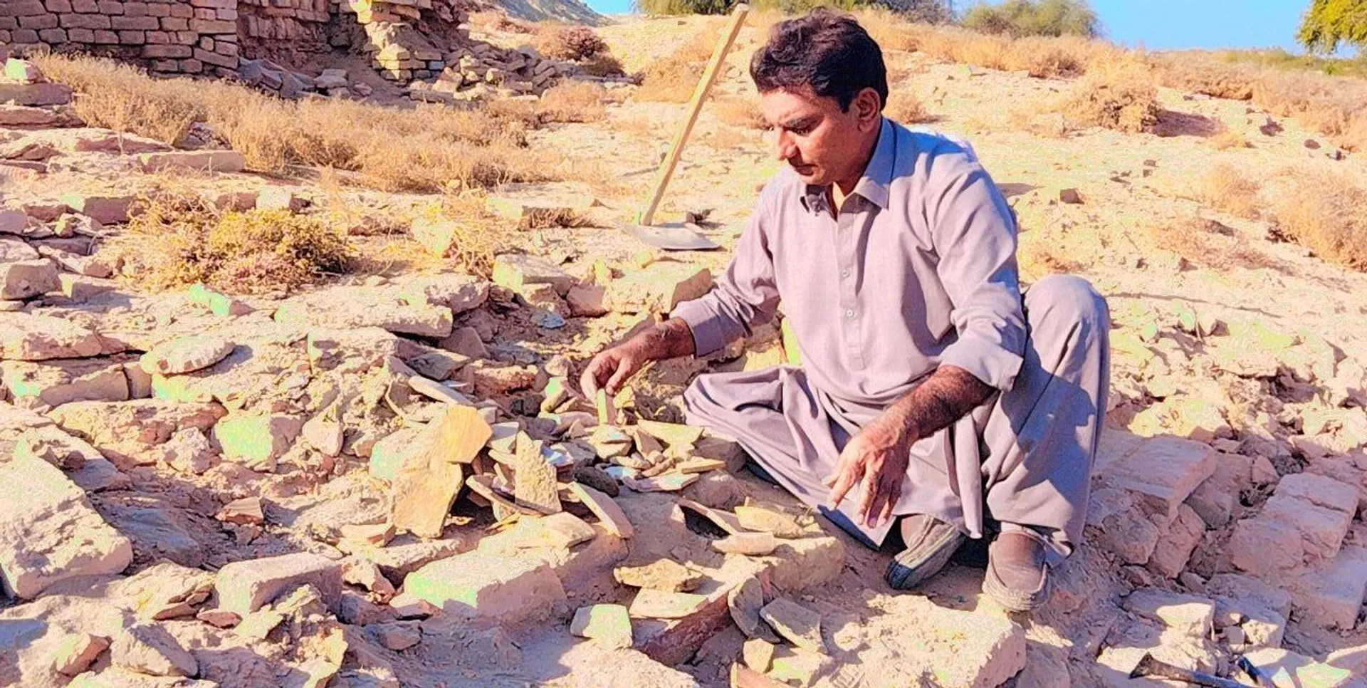 Sheikh Javed Ali Sindhi, Pakistani researcher scholar and tourist guide at Mohenjo-Daro Archaeological Site and Museum Sheikh Javed Ali Sindhi, Pakistani researcher scholar and tourist guide at Mohenjo-Daro Archaeological Site and Museum