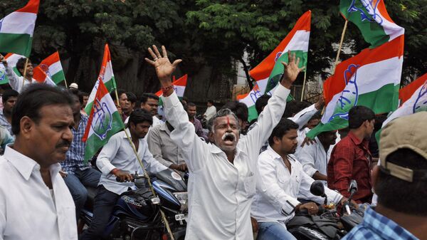 Indian Congress members and supporters celebrate after India's Union Cabinet approved the creation of a new state “Telangana” in Hyderabad, India, Friday, Oct. 4, 2013. - Sputnik India