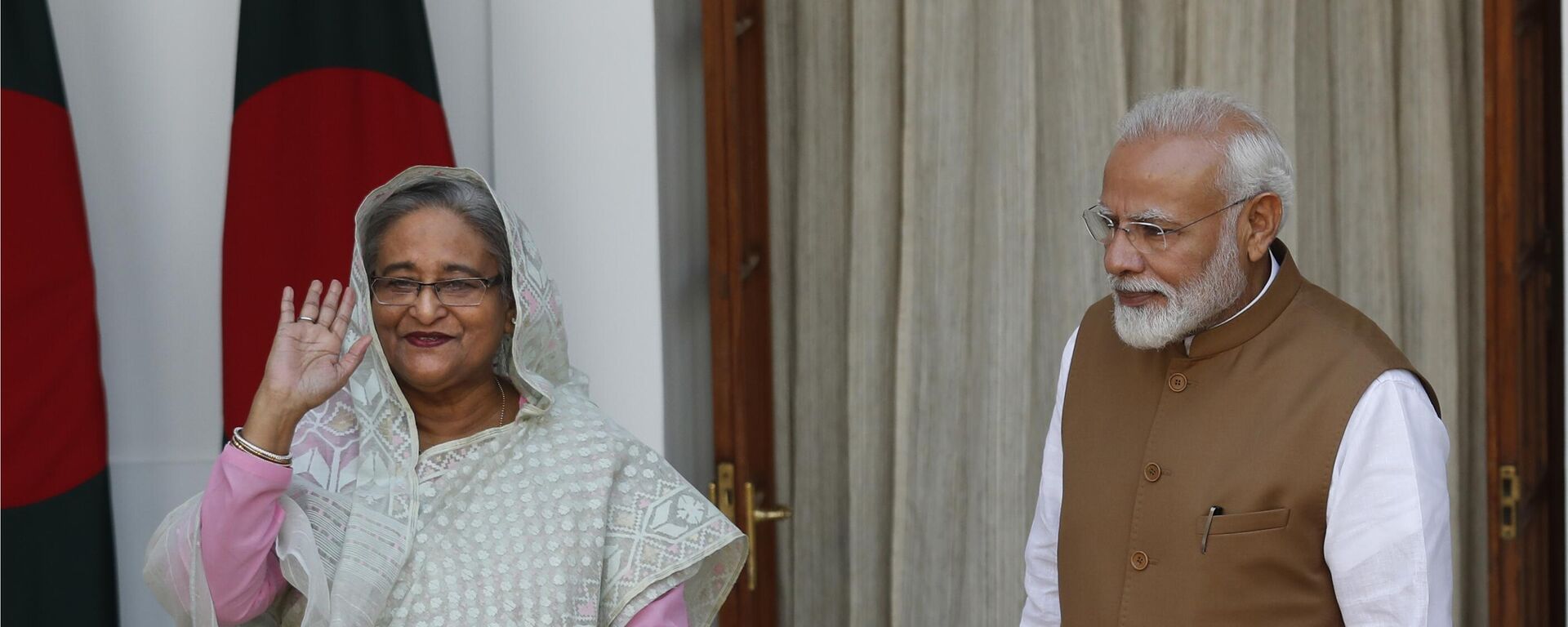 Indian Prime Minister Narendra Modi, right, watches his Bangladeshi counterpart Sheikh Hasina wave to the media before their meeting in New Delhi, India, Saturday, Oct. 5, 2019. - Sputnik India, 1920, 05.01.2024