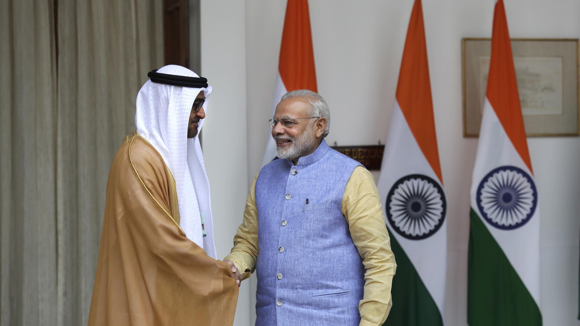 Indian Prime Minister Narendra Modi, right, shakes hand with Abu Dhabi's Crown Prince Sheikh Mohammed bin Zayed Al Nahyan before their delegation level meeting in New Delhi, India, Wednesday, Jan. 25, 2017. - Sputnik भारत, 1920, 29.12.2023