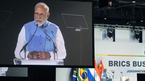 Indian Prime Minister Narendra Modi addresses leaders from the BRICS group of emerging economies at the start of a three-day summit in Johannesburg, South Africa, Tuesday, Aug. 22, 2023. - Sputnik India
