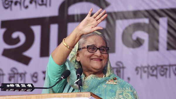 Bangladesh's Prime Minister Sheikh Hasina waves to the gathering during an election campaign rally for her ruling Awami League party, ahead of the upcoming national elections, in Sylhet, Bangladesh, Wednesday, Dec. 20, 2023. - Sputnik India