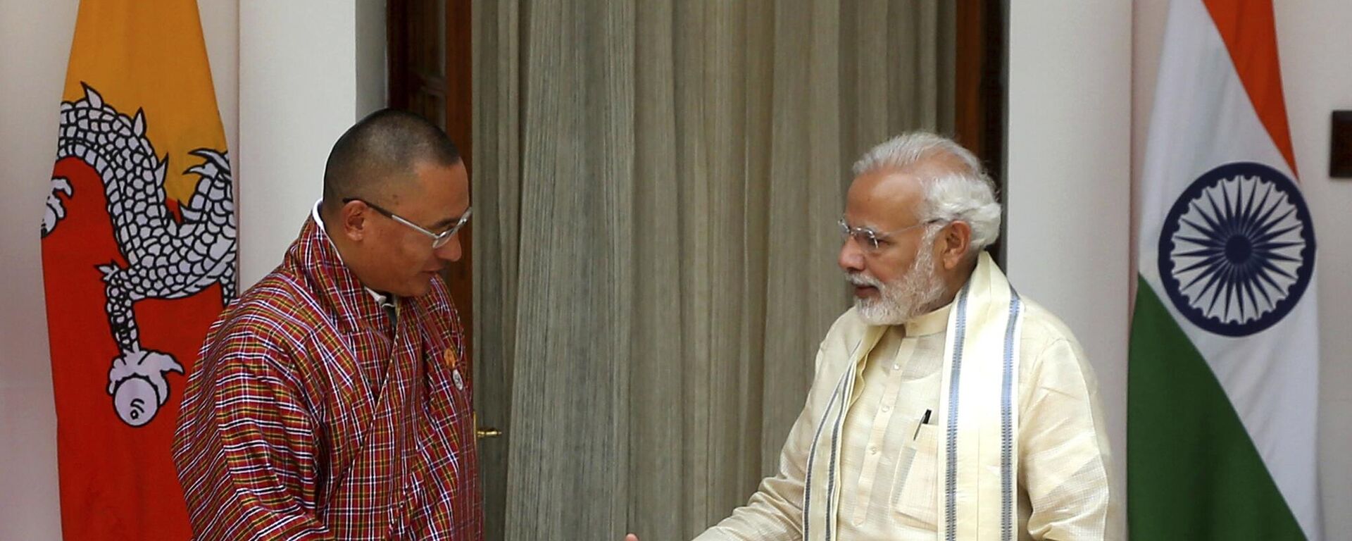 Indian Prime Minister Narendra Modi, right, prepares to shake hand with his Bhutan counterpart Tshering Tobgay in New Delhi, India, Friday, July 6, 2018.  - Sputnik India, 1920, 10.01.2024