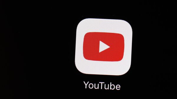 The YouTube app is displayed on an iPad on March 20, 2018, in Baltimore. YouTube will stop removing content that falsely claims the 2020 election or other past U.S. presidential elections were marred by “widespread fraud, errors or glitches, the platform announced Friday, June 2, 2023. - Sputnik India