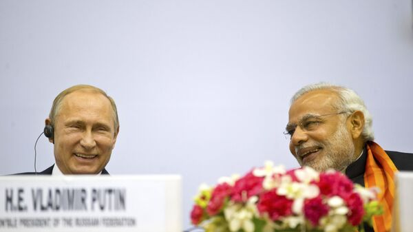 Indian Prime Minister Narendra Modi, right, and Russian President Vladimir Putin share a laugh as they attend a session of the World Diamond Conference in New Delhi, India, Thursday, Dec. 11, 2014. - Sputnik India