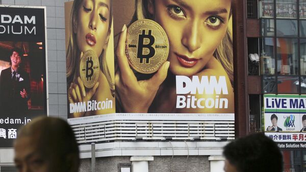 A huge advertisement of Bitcon is displayed near a train station in Tokyo Monday, Jan. 29, 2018 - Sputnik India