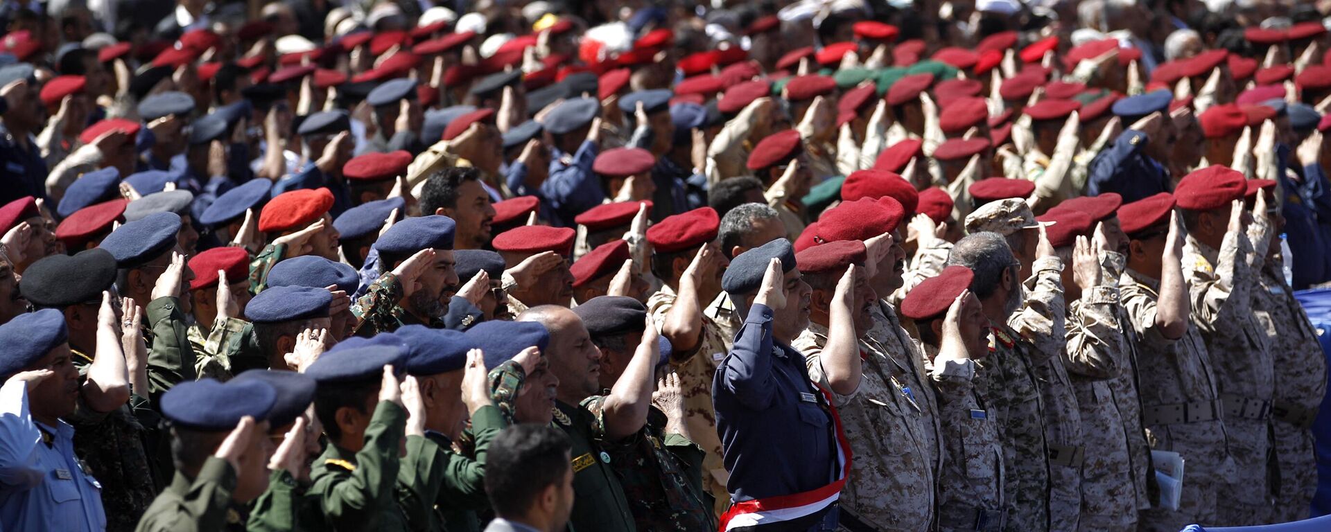 Army officers allied with the Houthis attend a rally to mark three years of war on the country, in the capital Sanaa on March 26, 2018.  - Sputnik भारत, 1920, 13.01.2024