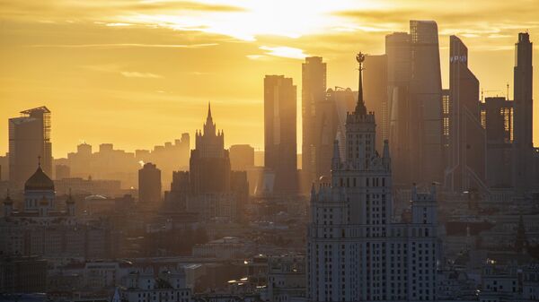 A view shows the Christ the Saviour Cathedral, Russian Foreign Ministry headquarters, a Soviet era high-rise building on Kotelnicheskaya Embankment and the skyscrapers of the Moscow International Business Centre, also known as Moskva-City, during sunset in Moscow, Russia. - Sputnik India