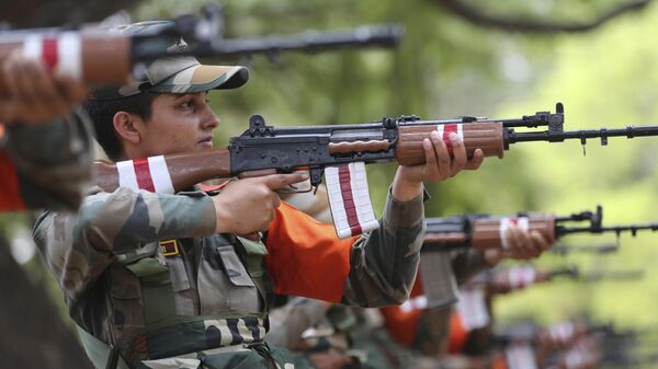 Indian army women recruits demonstrate their shooting skills as part of their training during a media visit in Bengaluru, India, Wednesday, March 31, 2021. - Sputnik भारत