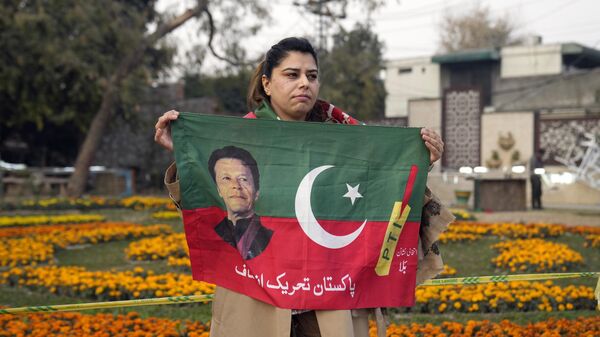 Supporter of former prime minister Imran Khan and political party Pakistan Tehreek-e-Insaf (PTI) attend during an election campaign rally in Lahore, Pakistan, Sunday, Jan. 28, 2024. - Sputnik India