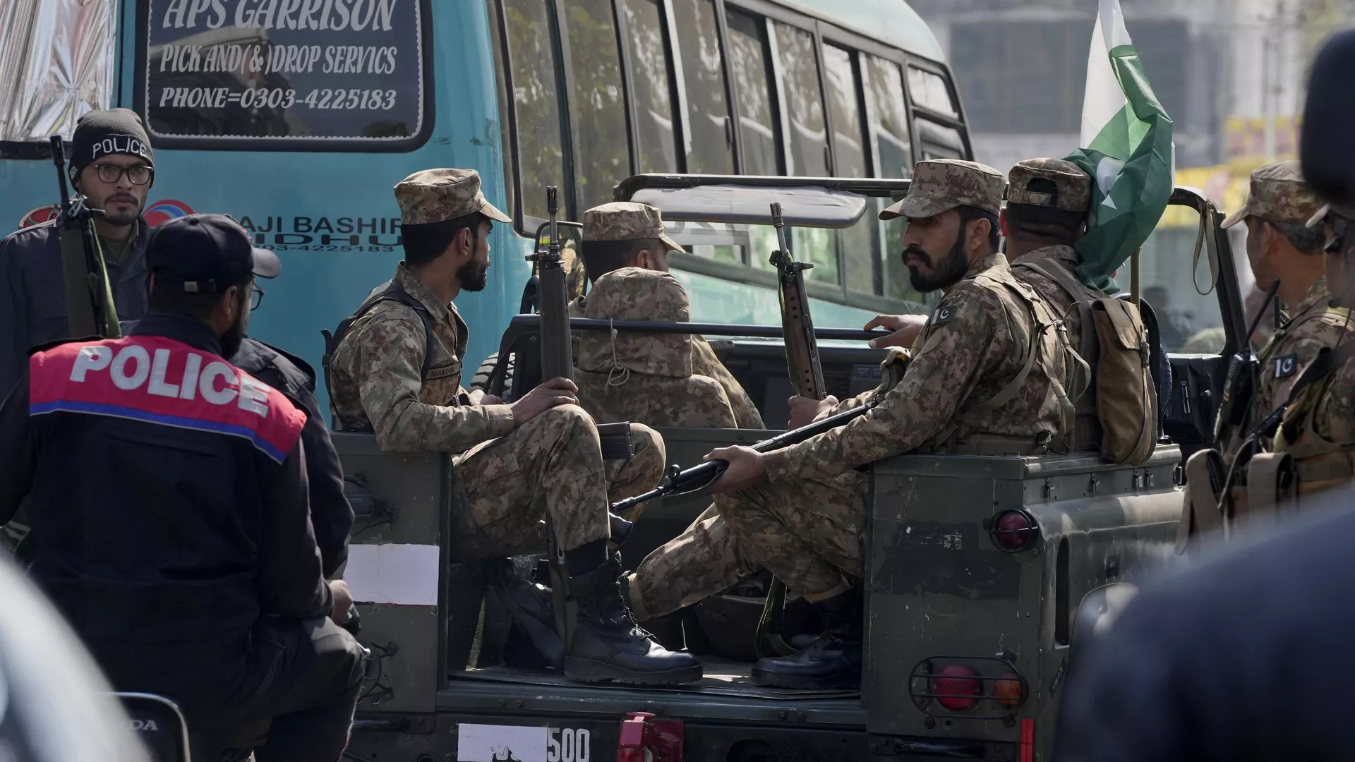 Army soldiers patrol on the vicinity of polling material distribution center to ensure security ahead of Feb. 8 general elections, in Lahore, Pakistan, Wednesday, Feb. 7, 2024.