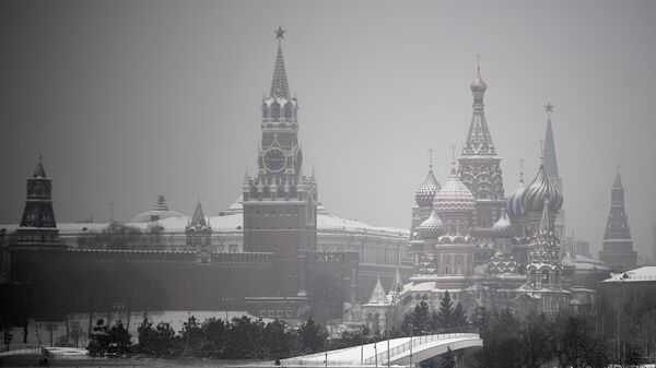 Spasskaya Tower and St. Basil's Cathedral are pictured on a foggy winter day, in downtown Moscow, Russia. - Sputnik भारत