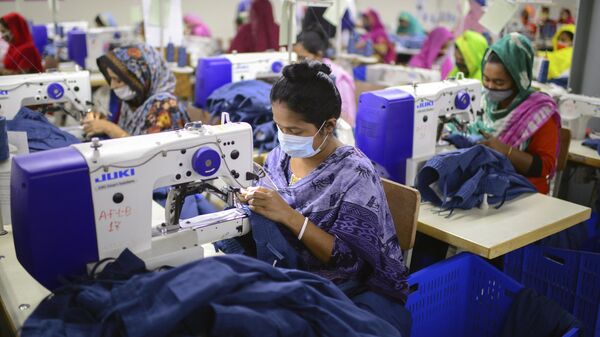 Garment employees work at Arrival Fashion Limited in Gazipur, Bangladesh, Saturday, March 13, 2021. - Sputnik India