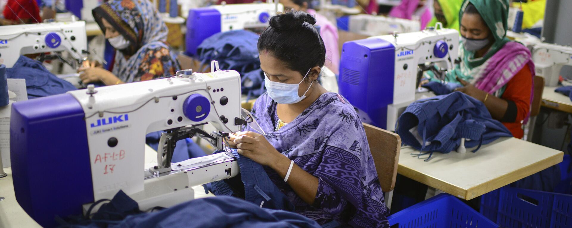 Garment employees work at Arrival Fashion Limited in Gazipur, Bangladesh, Saturday, March 13, 2021. - Sputnik India, 1920, 14.02.2024