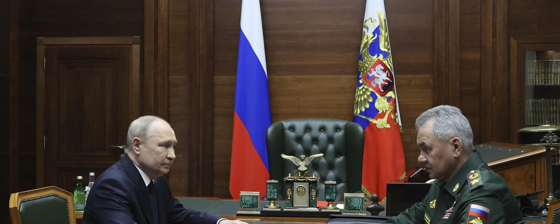 Russian President Vladimir Putin, left, listens to Russian Defense Minister Sergei Shoigu after their meeting with the top military brass in Moscow, Russia, Tuesday, Dec. 19, 2023.  - Sputnik भारत, 1920, 18.02.2024