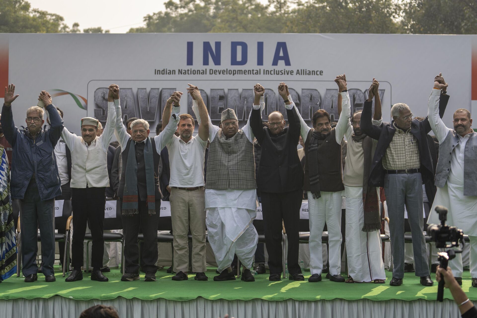 Leaders from the opposition INDIA alliance raise their hands together in a show of unity during a protest rally against the suspension of more than 140 lawmakers from parliament, in New Delhi, India, Friday, Dec. 22, 2023. - Sputnik India, 1920, 26.02.2024