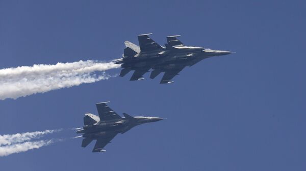 In this Jan. 23, 2015 file photo, Indian Air Force Sukhoi Su-30MKI fighters fly past during a full-dress rehearsal ahead of Republic Day parade in New Delhi, India.  - Sputnik भारत