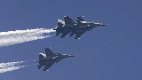 In this Jan. 23, 2015 file photo, Indian Air Force Sukhoi Su-30MKI fighters fly past during a full-dress rehearsal ahead of Republic Day parade in New Delhi, India.  - Sputnik भारत