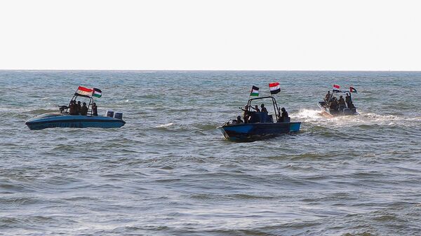 Members of the Yemeni Coast Guard affiliated with the Houthi group patrol the sea as demonstrators march through the Red Sea port city of Hodeida in solidarity with the people of Gaza on January 4, 2024, amid the ongoing battles between Israel and the militant Hamas group in Gaza. - Sputnik India