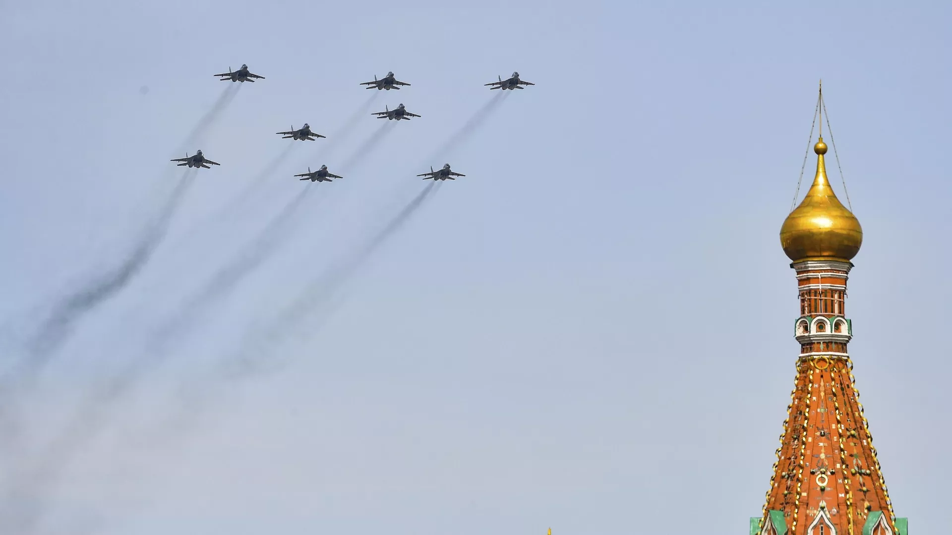 Russian MiG-29SMT fighter jets fly in the shape of the letter Z, which has become a symbol of the Russian military, and a hashtag reading We don't abandon our own, over Red Square during a dress rehearsal for the Victory Day military parade in Moscow, Russia, Saturday, May 7, 2022.