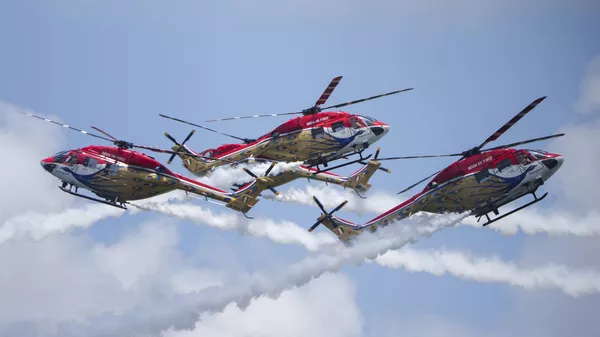 The Sarang Helicopter Display Team of the Indian Air Force (IAF) fly modified HAL Dhruv helicopters, also known as Advanced Light Helicopter (ALH), during the Singapore Airshow - Sputnik भारत