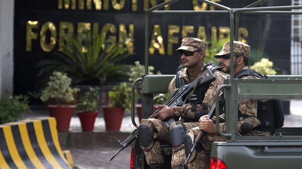 Pakistan army soldiers sit guard outside the Ministry of Foreign Affairs during a visit by U.S. Secretary of State Mike Pompeo arrives for talks in Islamabad, Pakistan, Wednesday, Sept. 5, 2018. - Sputnik India