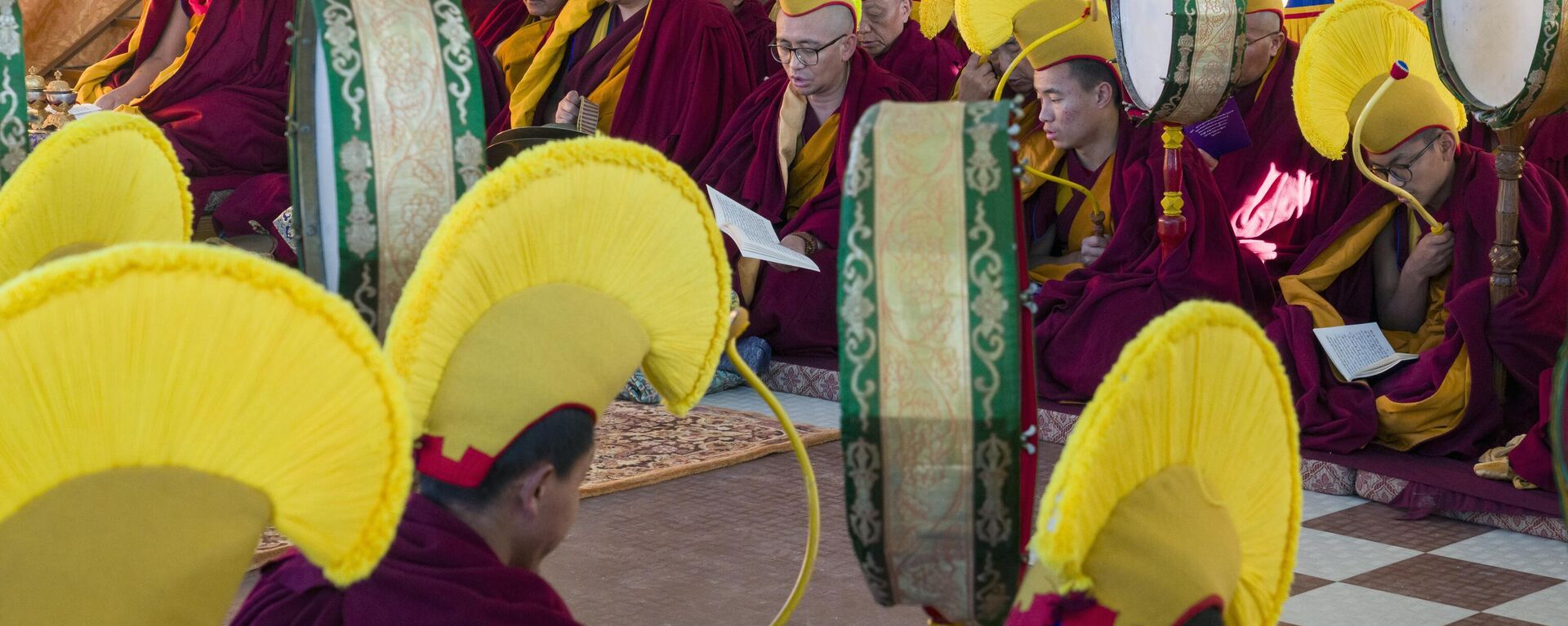 Exile Tibetan Buddhist monks wearing yellow hats of the Gelug school of the Tibetan Buddhism pray during an early morning session to mark the first day of the Tibetan new year at the Tsuglakhang temple in Dharamshala, India, Saturday, Feb. 10, 2024. - Sputnik India, 1920, 08.03.2024