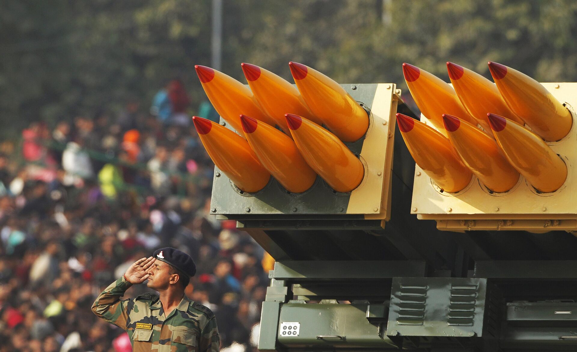 In this Jan. 26, 2011 file photo, an Indian army soldier salutes beside a Pinaka multiple rocket launcher at the Republic Day parade in New Delhi, India. In its race to join the club of international powers, India has reached another major milestone, it's now the world's largest weapons importer.  - Sputnik India, 1920, 13.03.2024
