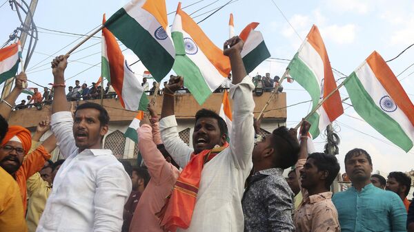 Activists of Akhand Bharat Sangarsh Samithi shout slogans and wave Indian flags during a rally supporting the implementation of Citizenship Amendment Act (CAA) in Hyderabad, India, Sunday, Feb. 2, 2020.   - Sputnik भारत