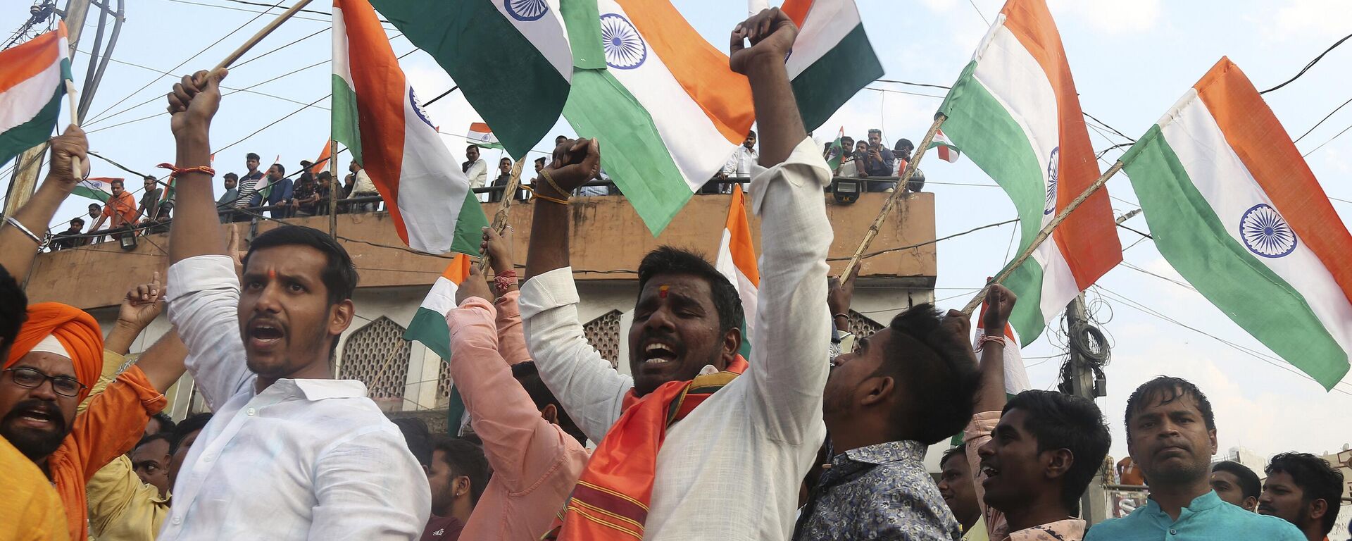 Activists of Akhand Bharat Sangarsh Samithi shout slogans and wave Indian flags during a rally supporting the implementation of Citizenship Amendment Act (CAA) in Hyderabad, India, Sunday, Feb. 2, 2020.   - Sputnik भारत, 1920, 11.03.2024