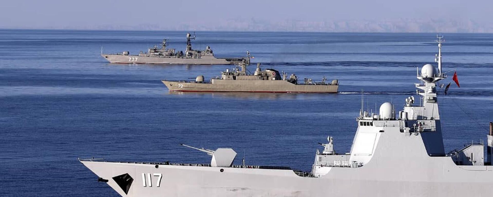 In this photo provided Saturday, Dec. 28, 2019, by the Iranian Army, warships sail in the Sea of Oman during the second day of joint Iran, Russia and China naval war games. - Sputnik भारत, 1920, 12.03.2024