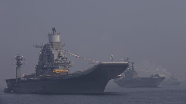 ndian aircraft carrier Vikramaditya is photographed in the foreground during the final rehearsal of International Fleet review in Vishakapatnam, India, Thursday, Feb. 4, 2016.  - Sputnik India