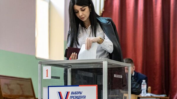 A woman is seen casting a ballot at a polling station in South Ossetia's Tskhinval during the 2024 Russian presidential elections. File photo - Sputnik India