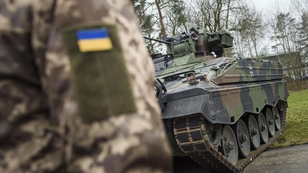 A Ukrainian soldier is standing in front of a Marder infantry fighting vehicle at the German forces Bundeswehr training area in Munster, Germany, on Feb. 20, 2023.  - Sputnik भारत