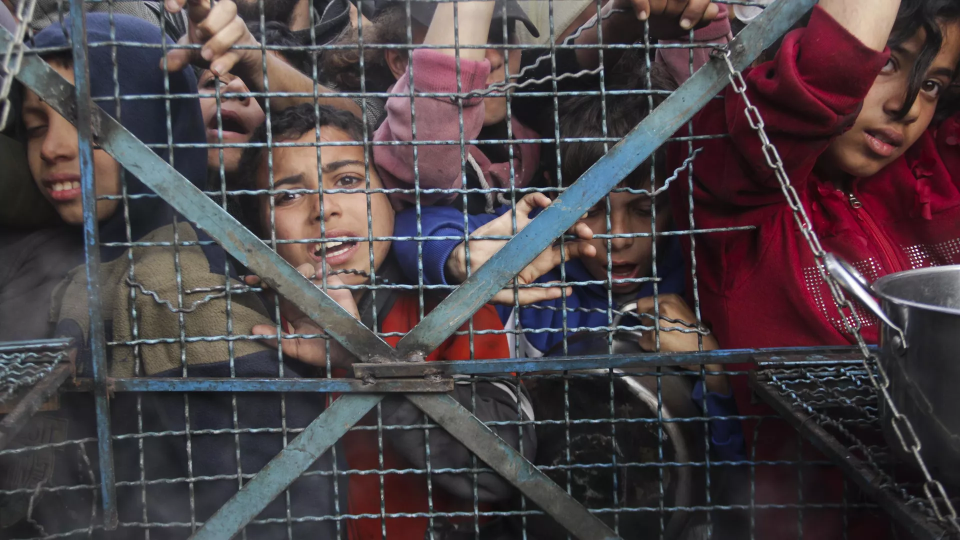 Palestinians line up to receive free meals at Jabaliya refugee camp in the Gaza Strip on Monday, March 18, 2024. (AP Photo/Mahmoud Essa)