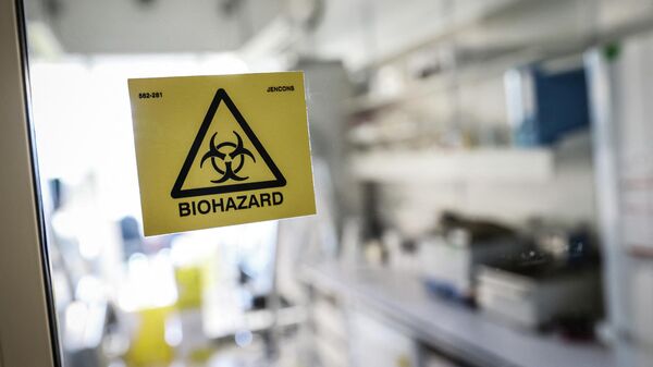 A biohazard sticker on the entrance of a laboratory. - Sputnik भारत