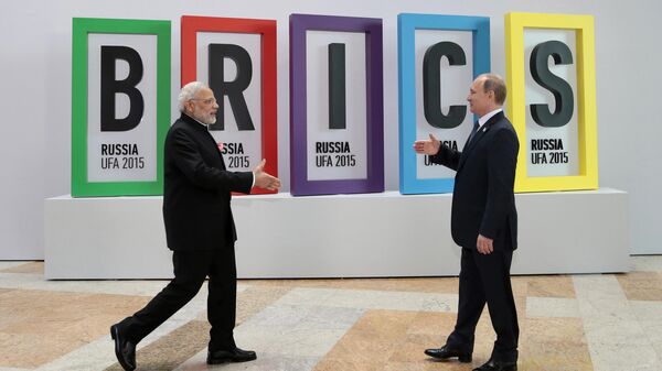 In this July 9, 2015, file photo, Indian Prime Minister Narendra Modi, left, and Russian President Vladimir Putin prepare to shake hands prior to their talks during the BRICS Summit in Ufa, Russia. - Sputnik India